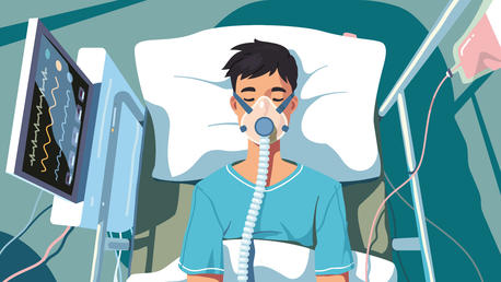 Junger Patient liegt im Bett mit Sauerstoffmaske